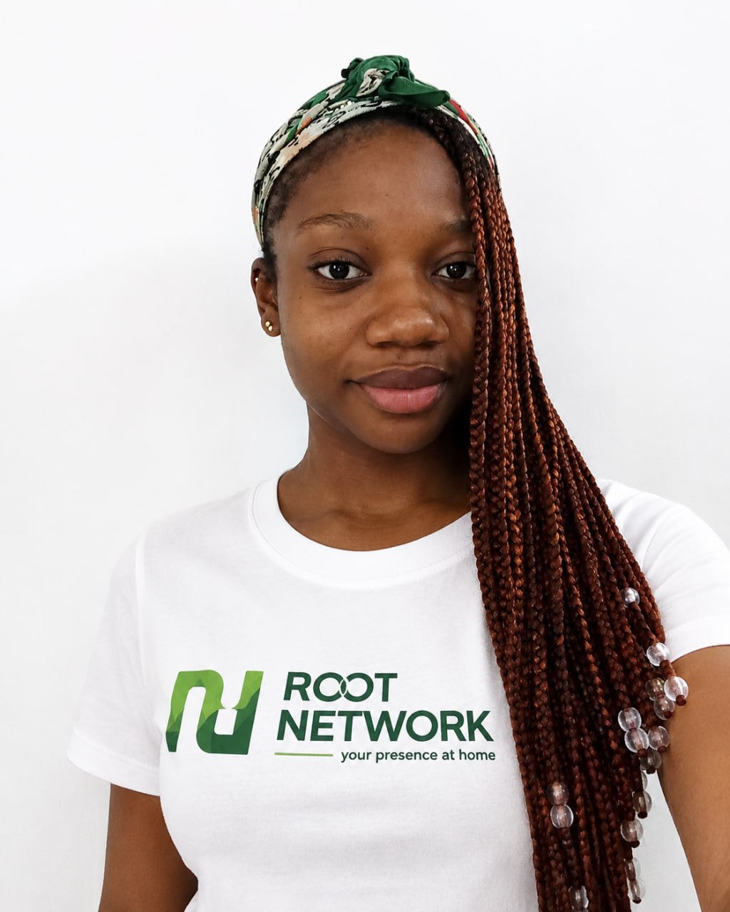A Root Network Field Associate wearing a Root Network shirt